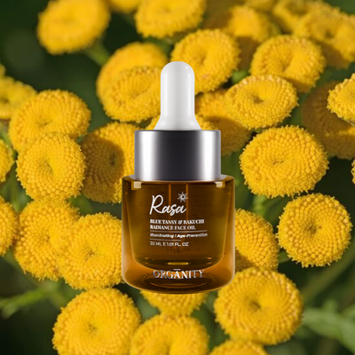 Brown Rasa skincare bottle with dropper on yellow flowers