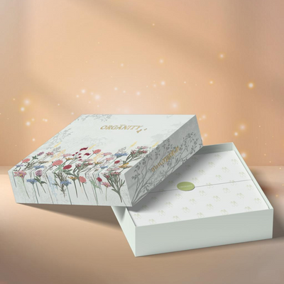 Gift box with floral design on a soft peach background